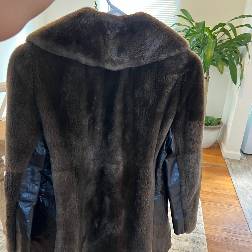 Vintage Faux fur coat with faux leather slits on side, small detailing.